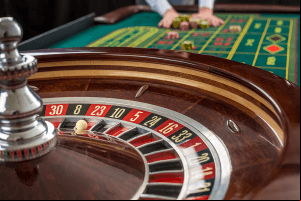 Casino roulette table with gambling chips